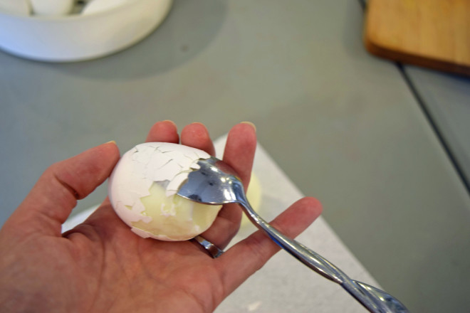 Peel eggs with a spoon