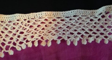 closeup of crocheted pompom trim